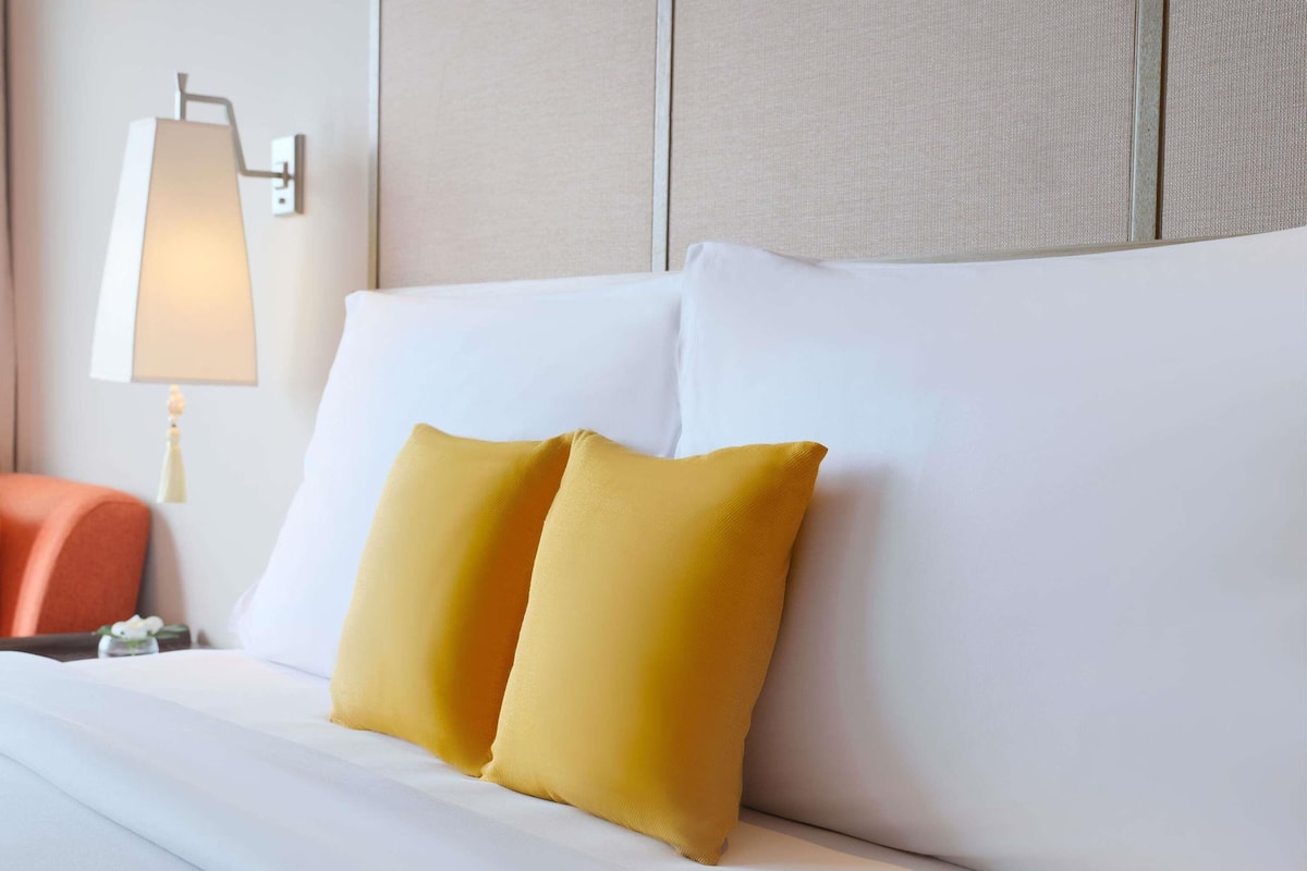 Down comforters, pillowtop beds, in-room safe, desk