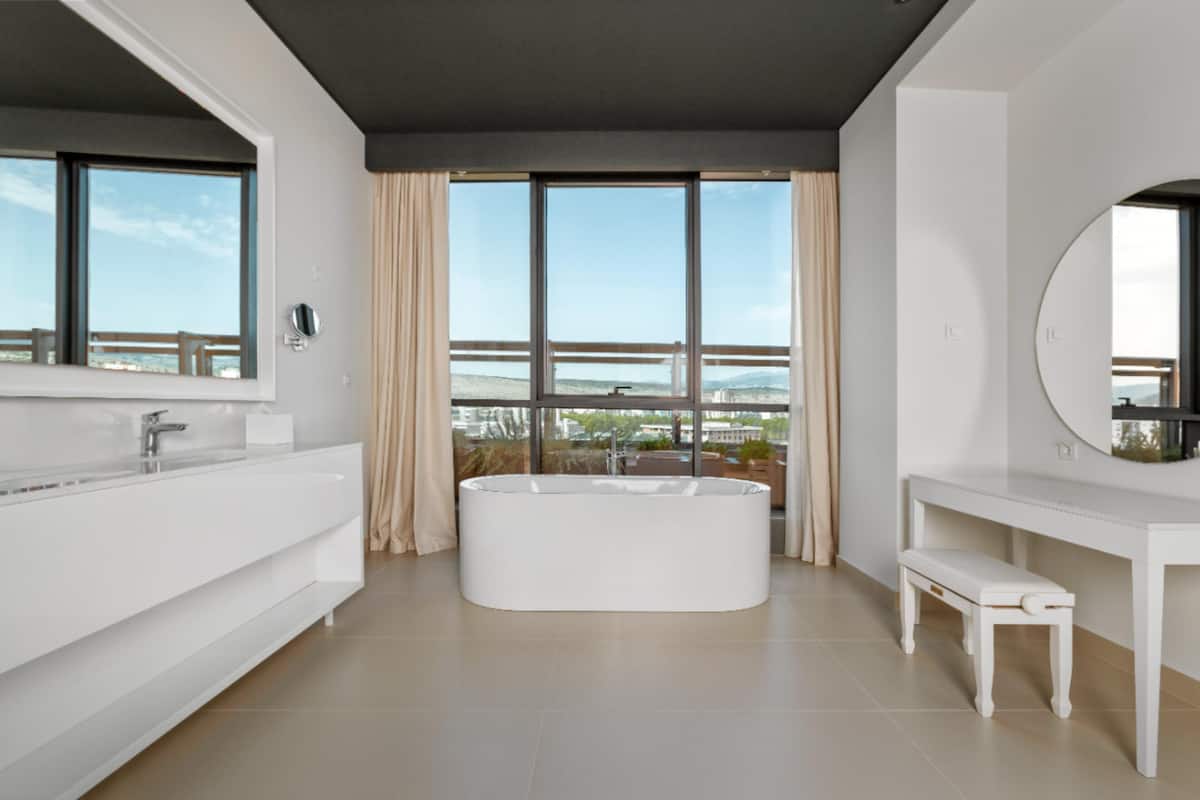 designer toiletries, hair dryer, bathrobes, slippers