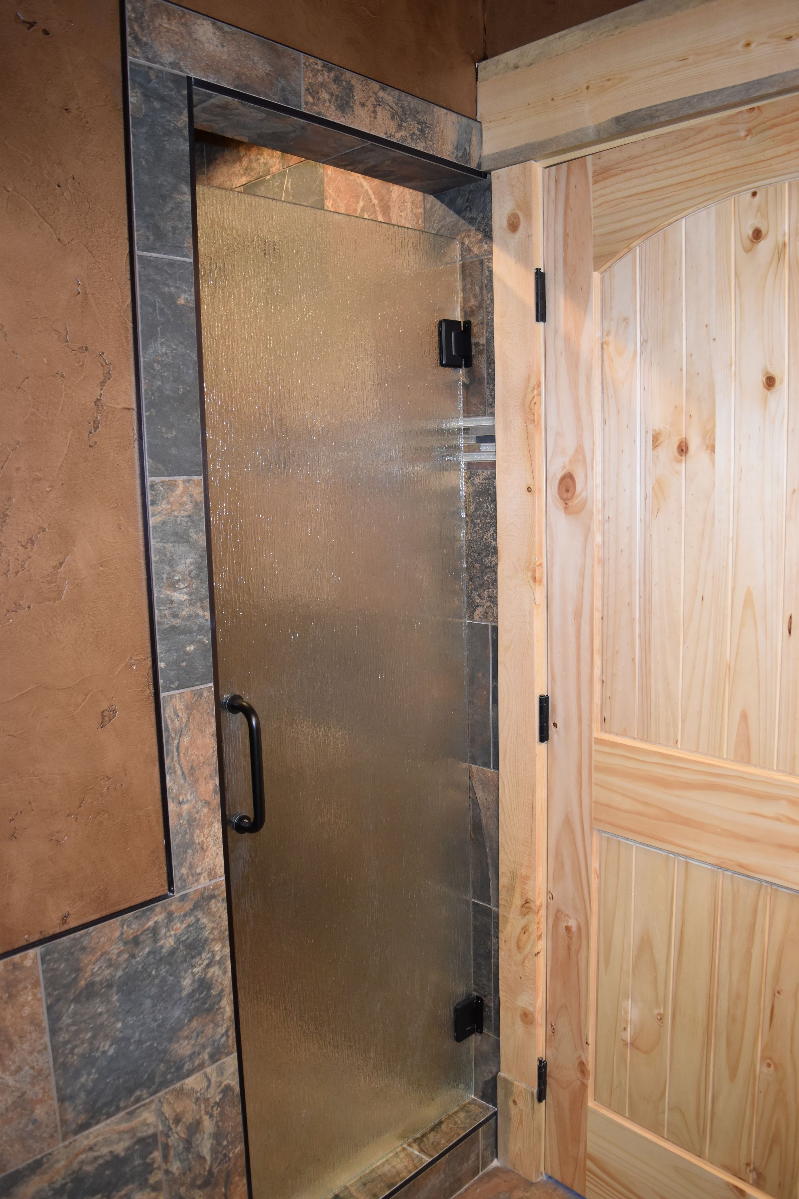 small cabin, king bed | bathroom shower