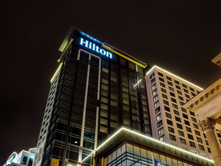 A high-rise building with the "Hilton" sign prominently displayed at the top.
