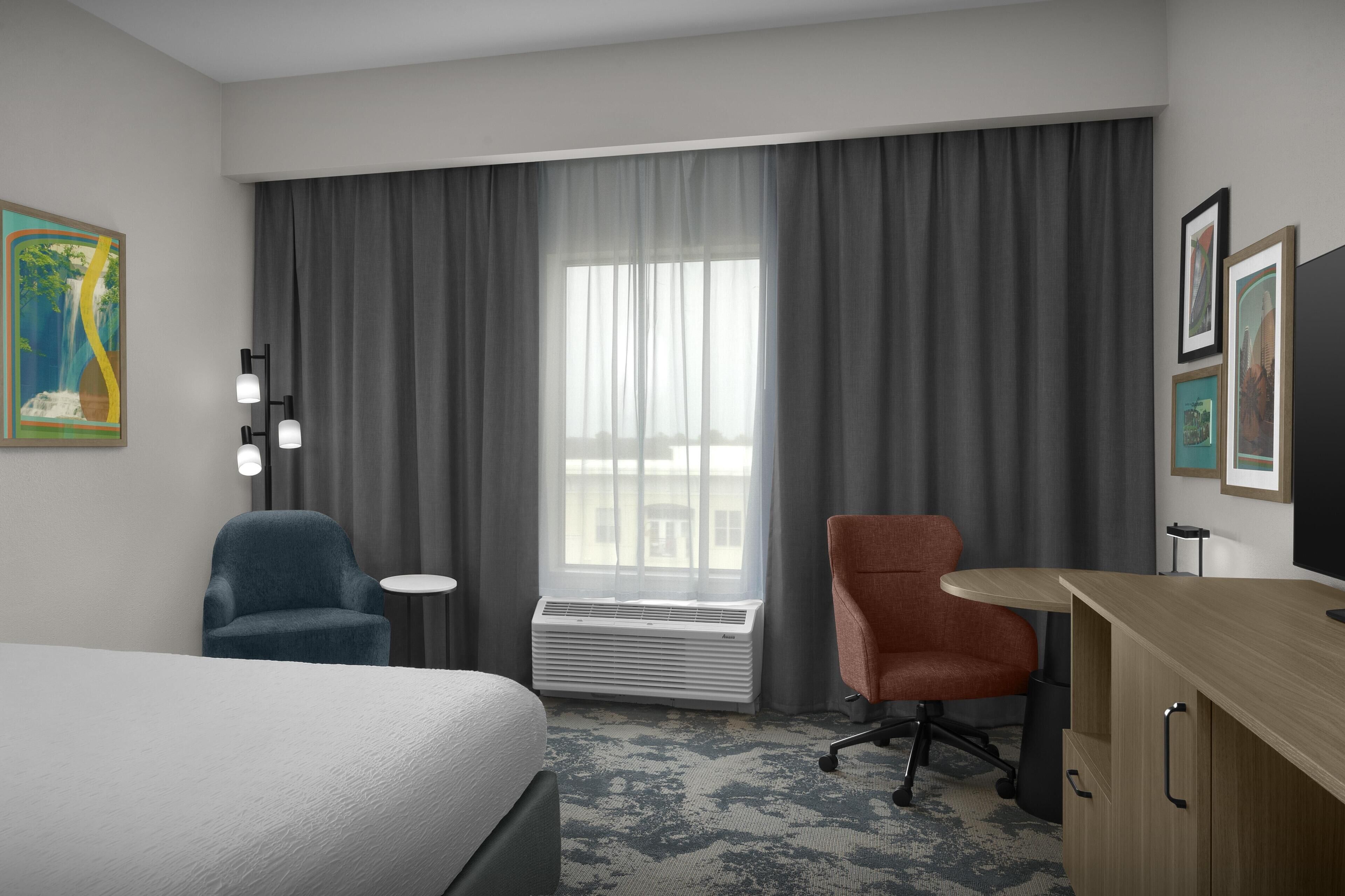 Desk, laptop workspace, blackout drapes, iron/ironing board