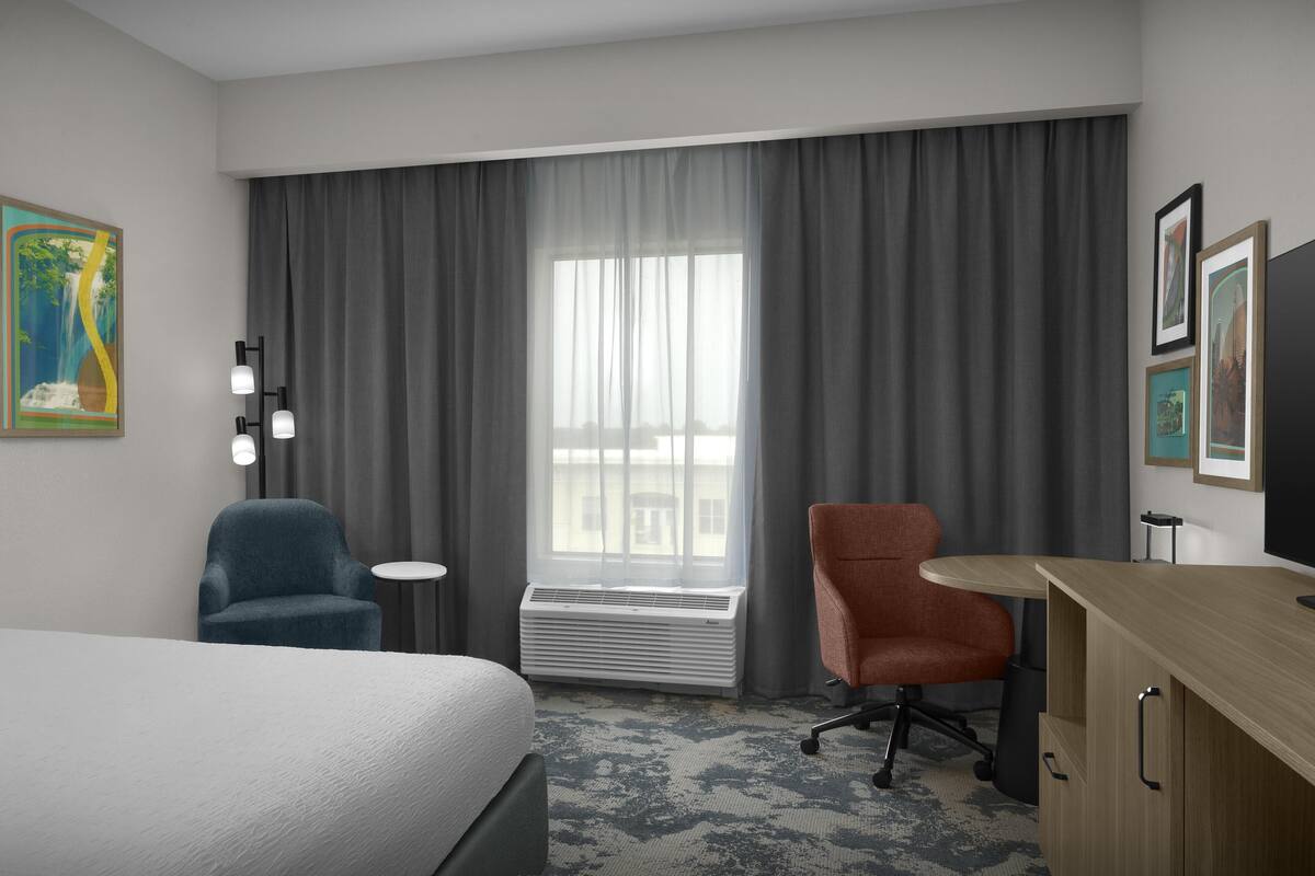 Desk, laptop workspace, blackout drapes, iron/ironing board