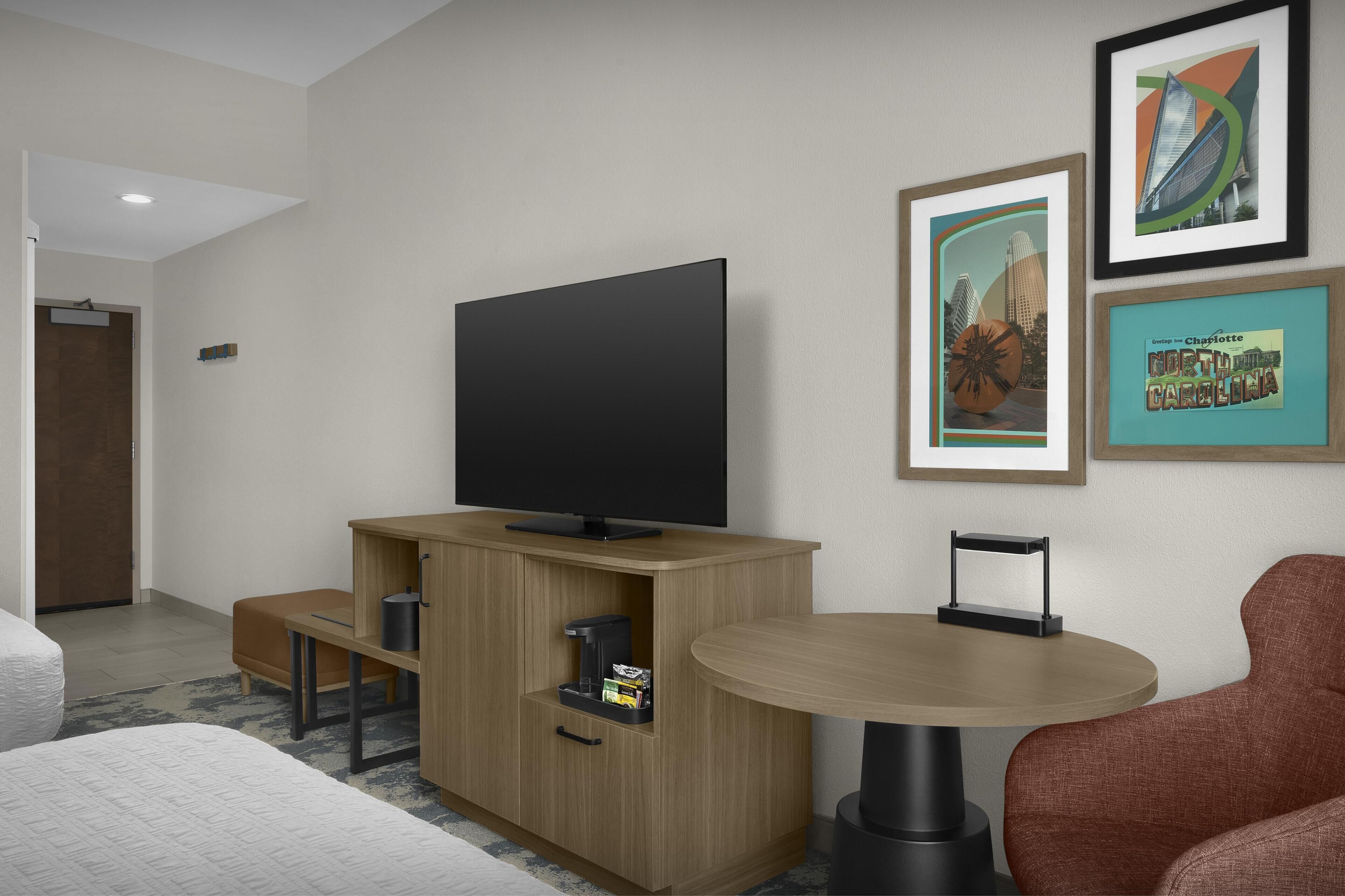 Desk, laptop workspace, blackout drapes, iron/ironing board