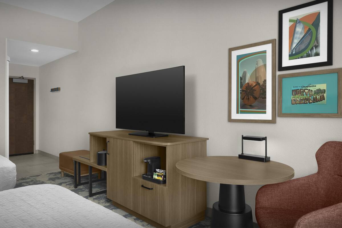 Desk, laptop workspace, blackout drapes, iron/ironing board