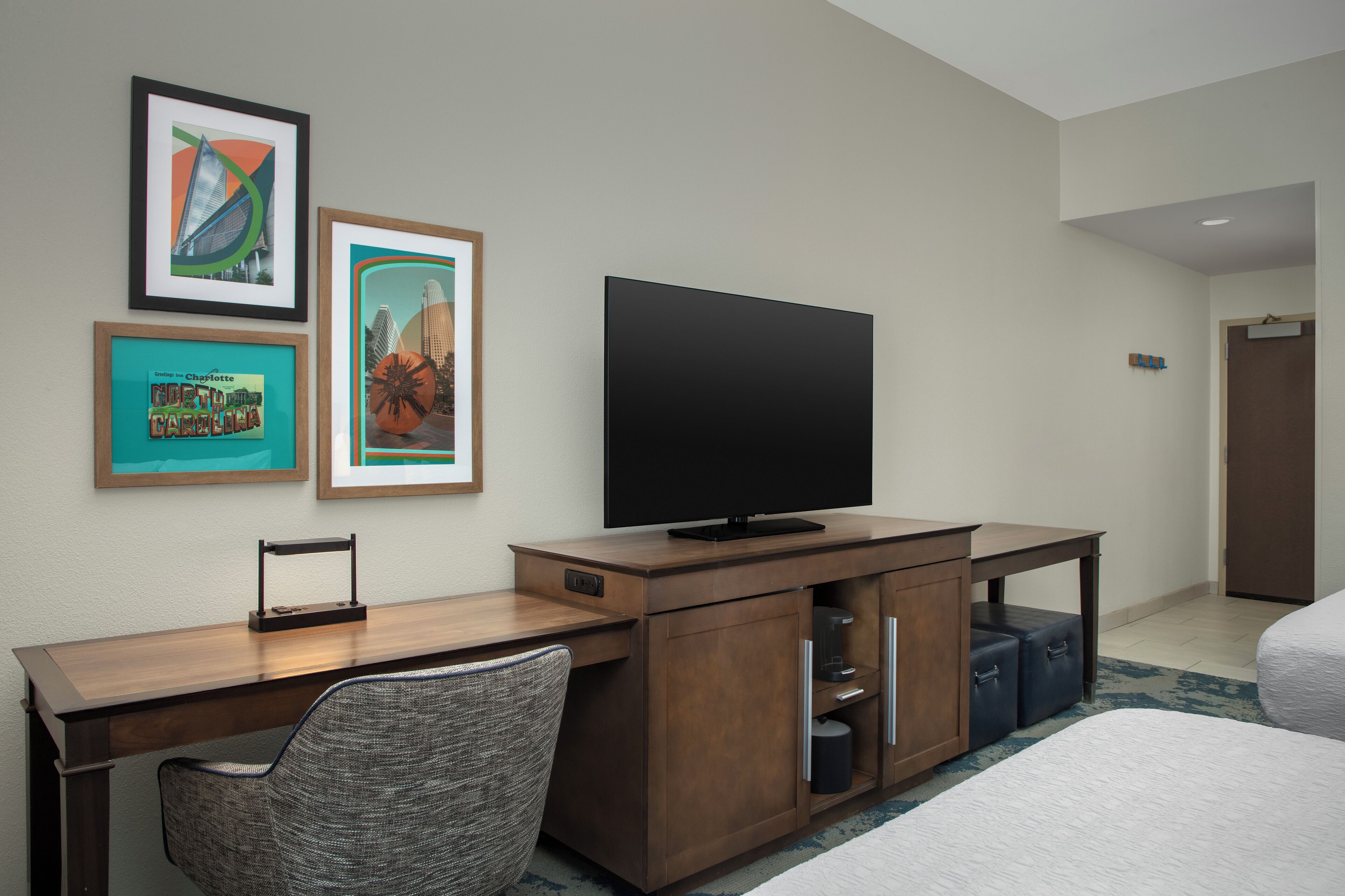 Desk, laptop workspace, blackout drapes, iron/ironing board