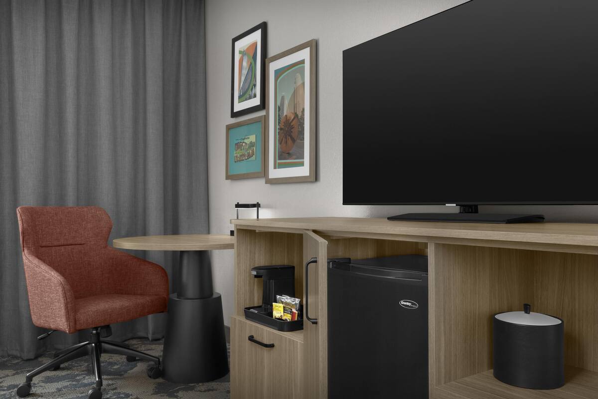 Desk, laptop workspace, blackout drapes, iron/ironing board