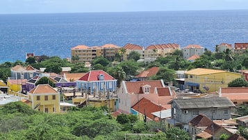 A coastal town with colorful buildings and a view of the sea.