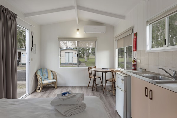 Standard Cabin (Sleeps 2) | Living area | Flat-screen TV