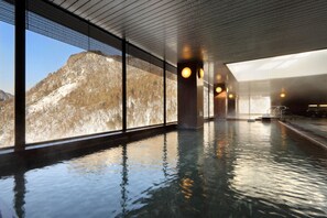 Relax by the pool with a breathtaking view of the surrounding mountains.