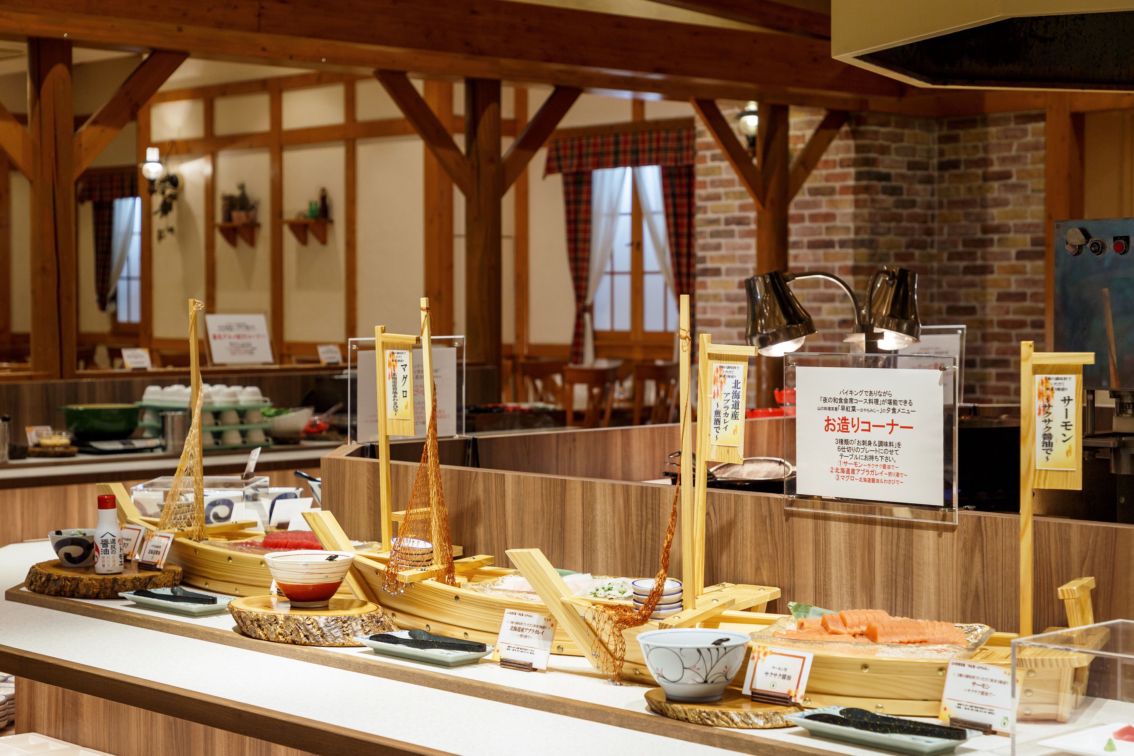 A sushi bar with wooden beams and brick walls.