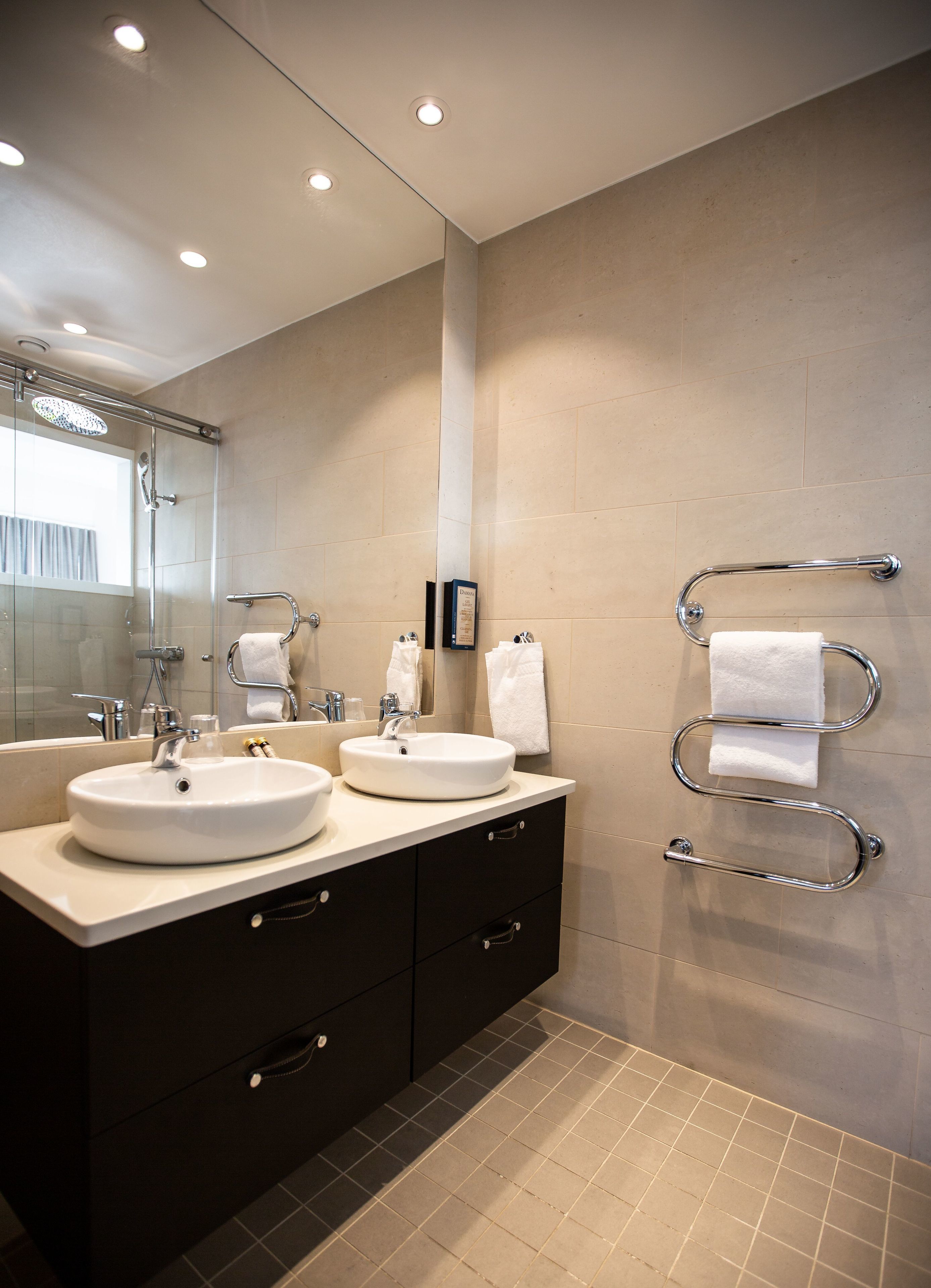 junior suite | bathroom | shower, free toiletries, bathrobes, slippers