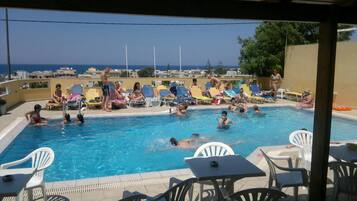 Outdoor pool, pool umbrellas, sun loungers