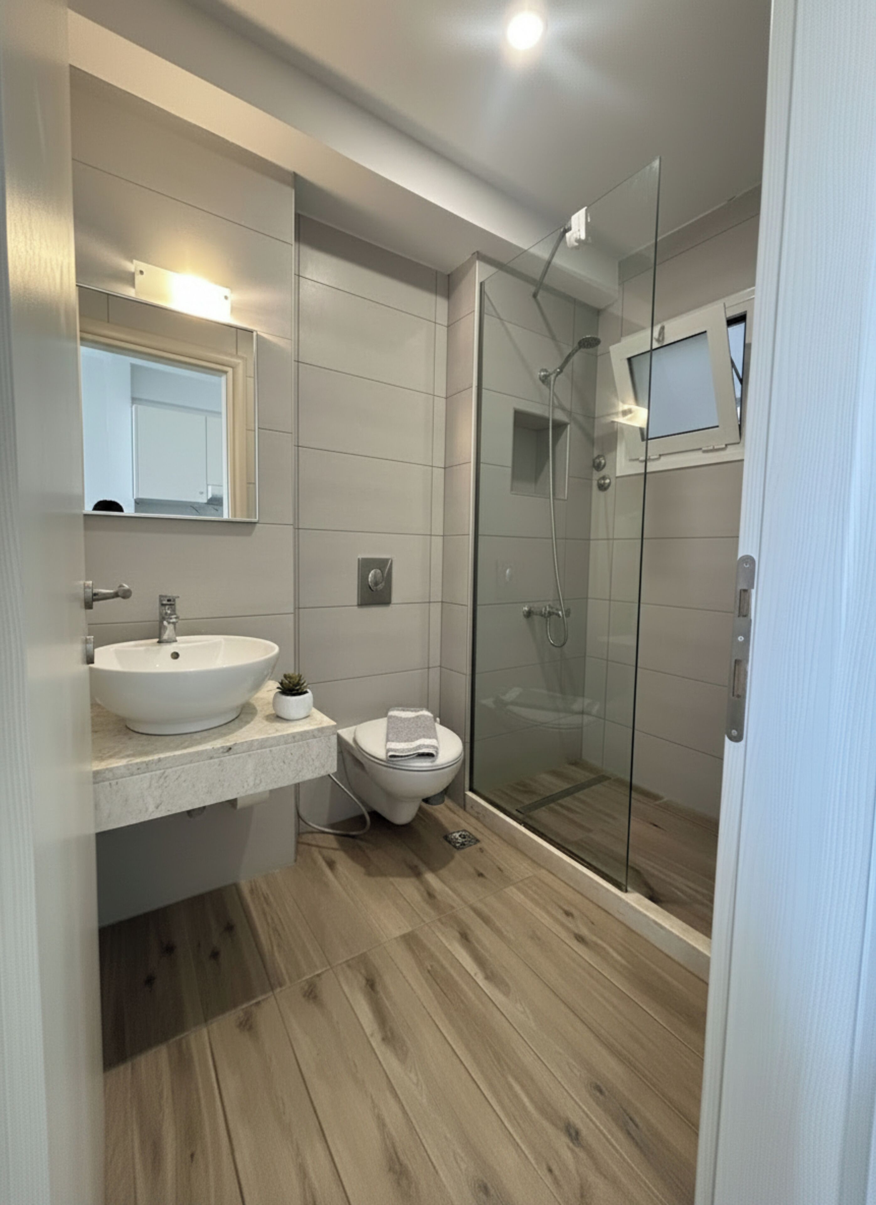 Bathtub, hair dryer, towels, toilet paper