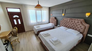 Deluxe Triple Room, Multiple Beds, Non Smoking, Sea View | Premium bedding, individually decorated, individually furnished, desk