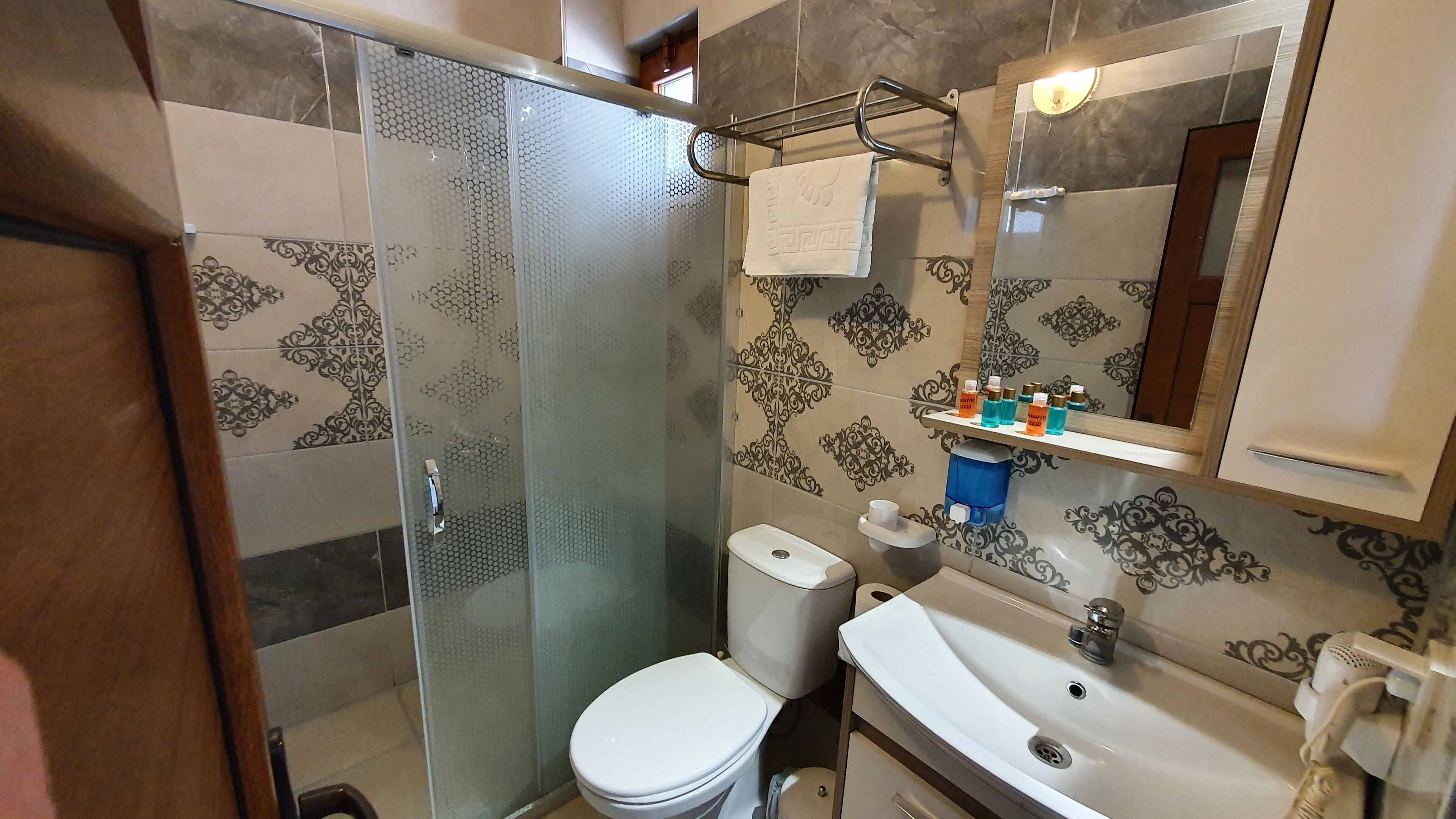 deluxe triple room, multiple beds, non smoking, sea view | room amenity