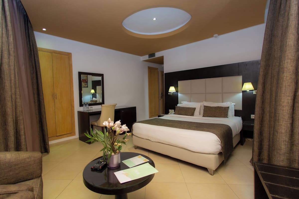 deluxe double room | premium bedding, in-room safe, desk, blackout curtains