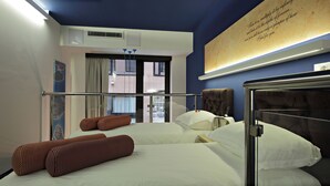 A hotel room with a large bed, a window with curtains, a wall-mounted artwork, and a ceiling vent. - Residence Park (Zagreb)