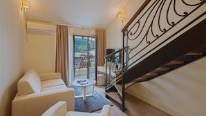 Deluxe Apartment, 2 Bedrooms, Balcony, Sea View | Living room | Flat-screen TV - Aparthotel Villa Aria (Budva)