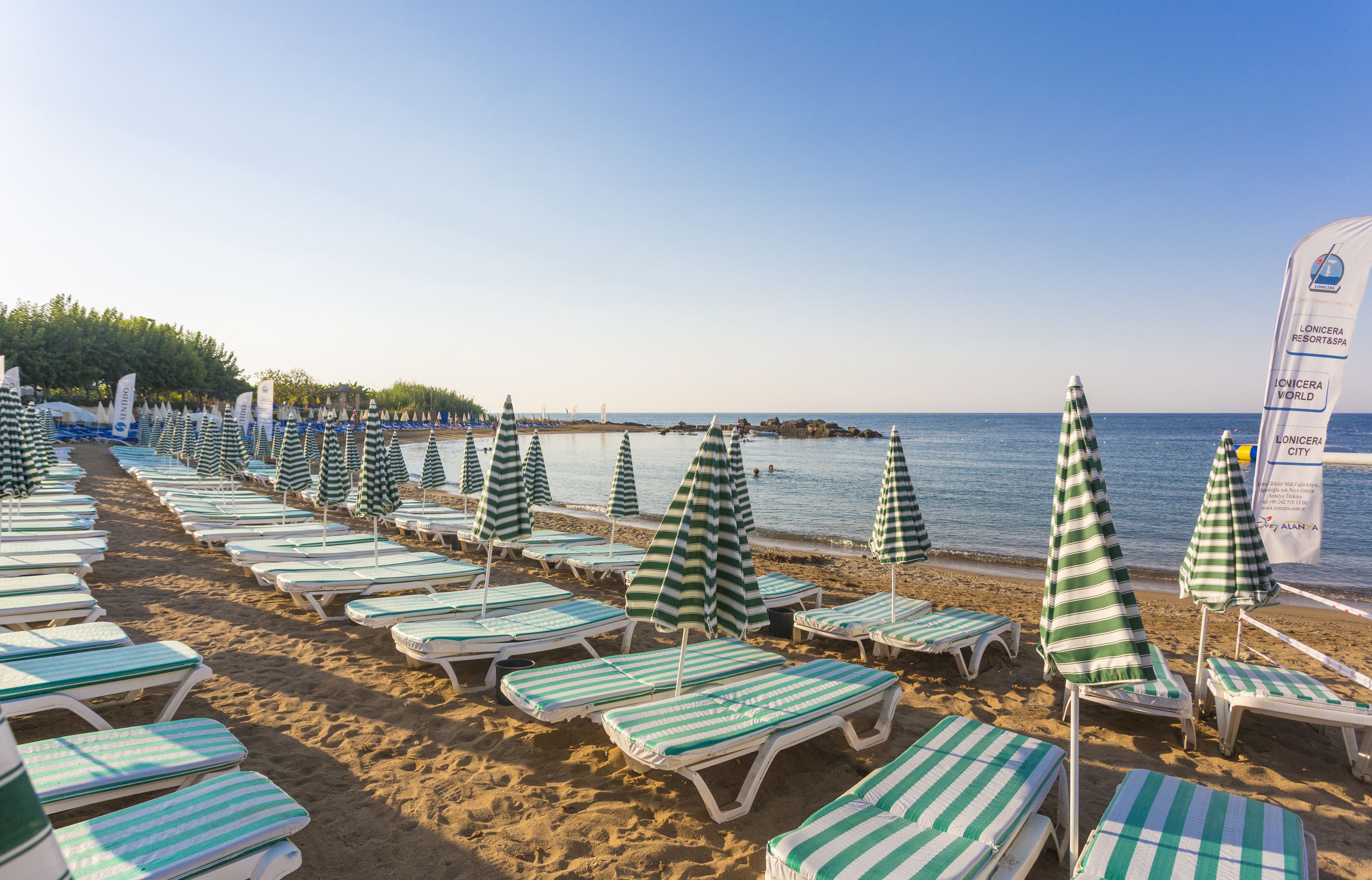 private beach, sun-loungers, beach umbrellas, beach towels