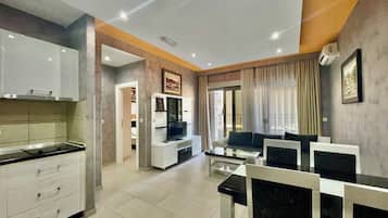 Standard Apartment, 1 Bedroom | Living area | 42-inch flat-screen TV with cable channels, TV