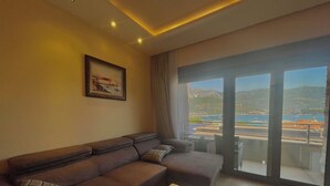 Luxury Apartment, 2 Bedrooms | Living area | 42-inch flat-screen TV with cable channels, TV - Butua Residence (Budva)