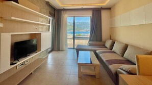 Superior Apartment | Living area | 42-inch flat-screen TV with cable channels, TV - Butua Residence (Budva)