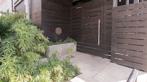 A wooden gate with a sign that reads "The Hotel." - The 404 Hotel (Nashville)