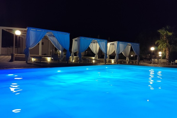Seasonal outdoor pool, open 10:00 AM to 7:00 PM, pool umbrellas