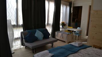 Studio | Premium bedding, desk, blackout drapes, iron/ironing board