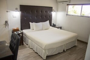 In-room safe, desk, laptop workspace, iron/ironing board - Altamont West Hotel (Montego Bay)
