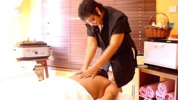 Experience rejuvenation with a soothing massage on our comfortable massage table, featuring a range of treatments.