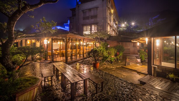 A traditional Japanese-style building with a wooden deck and potted plants. - WULAI SungLyu spring resort (New Taipei City)
