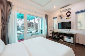 Family Room | Minibar, in-room safe, blackout curtains, iron/ironing board - A25 Hotel - 57 Quang Trung (Hanoi)