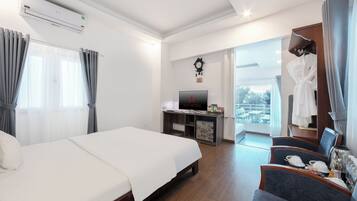 Family Room | Minibar, in-room safe, blackout drapes, iron/ironing board