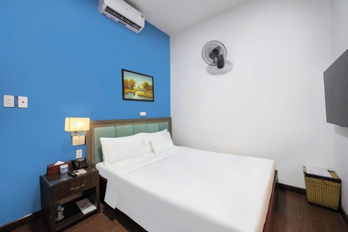 Standard Double Room | Minibar, in-room safe, blackout drapes, iron/ironing board