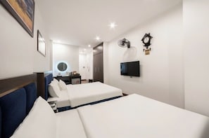 Family Room | Minibar, in-room safe, blackout drapes, iron/ironing board