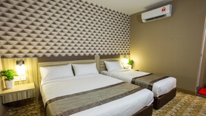 A hotel room with two beds, a patterned carpet, a textured wall, and an air conditioning unit. - LS Hotel (Masai)