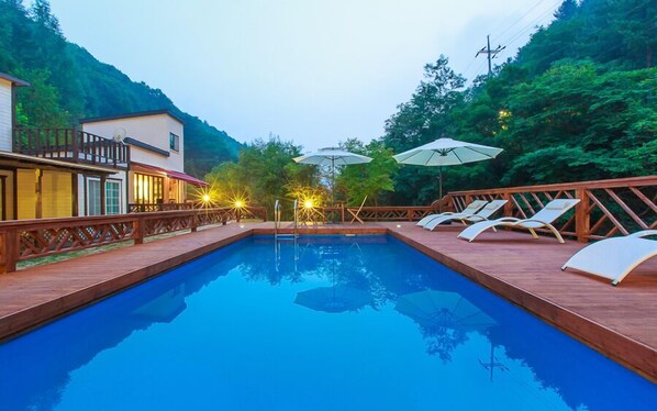 Seasonal outdoor pool, pool umbrellas, pool loungers