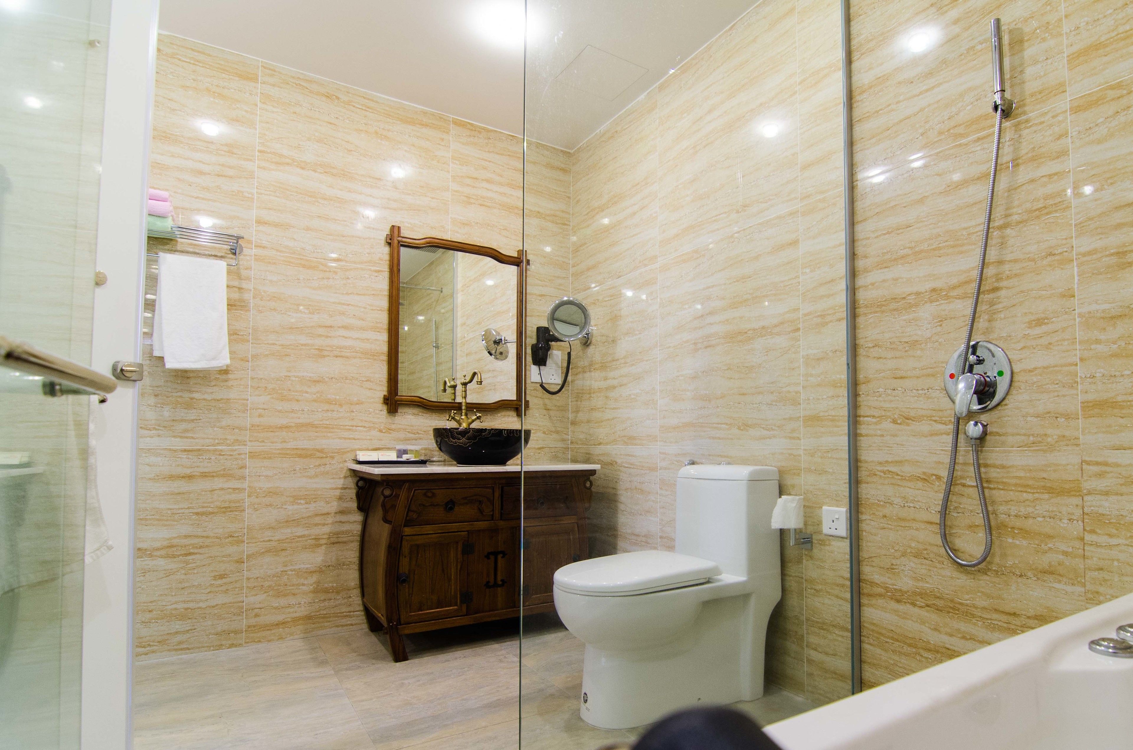 deluxe suite ( 3  ) | bathroom | shower, free toiletries, hair dryer, slippers