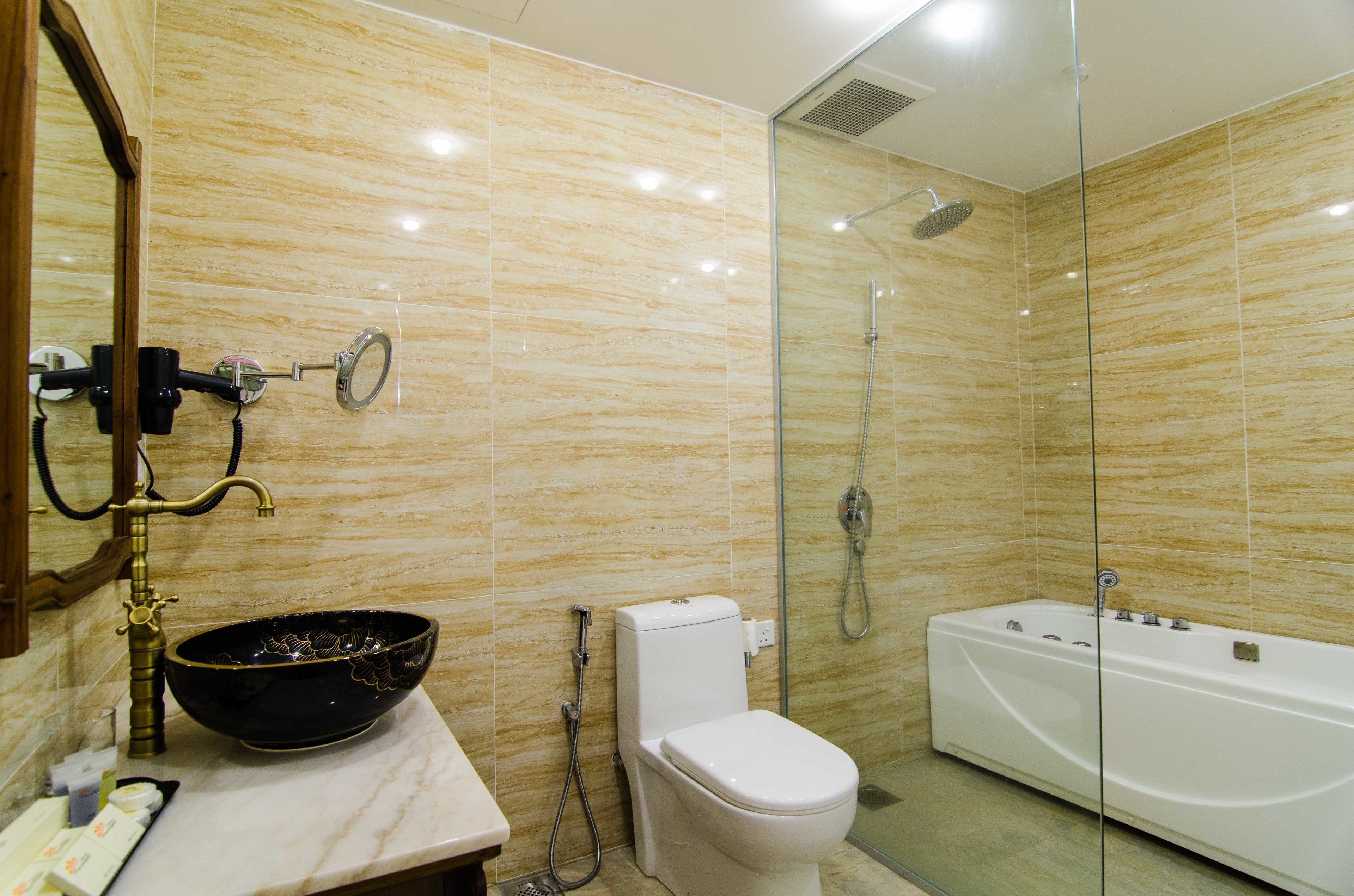 deluxe suite ( 3  ) | bathroom | shower, free toiletries, hair dryer, slippers