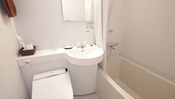 A modern bathroom with a white sink, toilet, and bathtub.