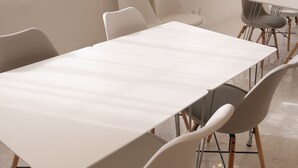 A modern, well-lit room with white tables and chairs, large windows with sheer curtains, and a clean, minimalist design. - Hotel Imalle Yokohama Isezakicho - Hostel (Yokohama)