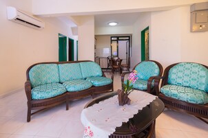 Triple Room | Living area | Flat-screen TV