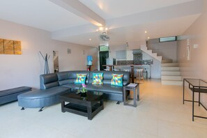 Family Suite, 3 Bedrooms | Living area | 32-inch TV with cable channels - Reef Beach Resort (General Luna)