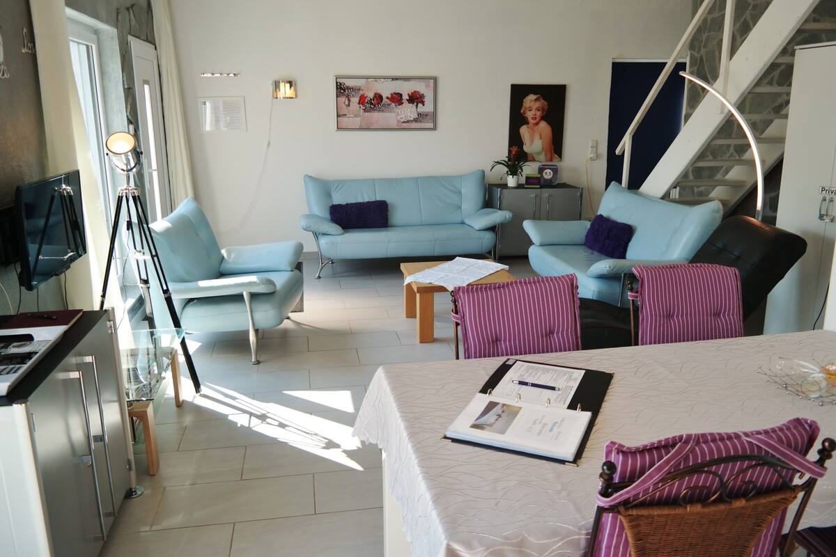 Deluxe Apartment, 1 Bedroom, Terrace, Garden View | Living area | Flat-screen TV, DVD player, heated floors
