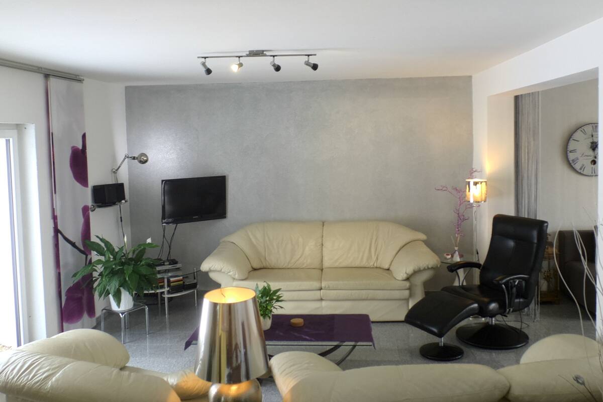 Deluxe Apartment, 2 Bedrooms, Garden View, Ground Floor | Living area | Flat-screen TV, DVD player, heated floors
