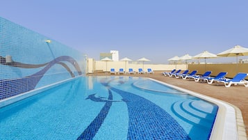 Outdoor pool, pool umbrellas, sun loungers
