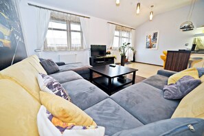 Comfort Penthouse, 2 Bedrooms (Wypoczynkowa 8) | Living area | Flat-screen TV - Grand Apartments - Neptun Park (Gdansk)