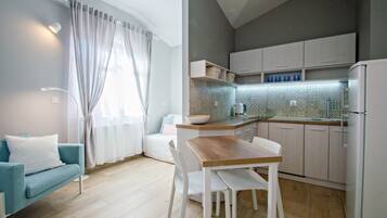 Standard Apartment (Wypoczynkowa 34A) | Living area | Flat-screen TV