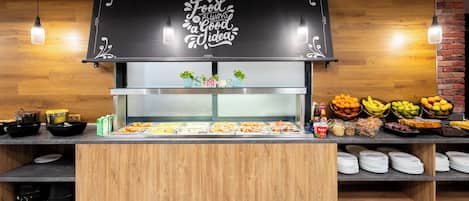 A buffet setup with a sign saying "Food is always a good idea."